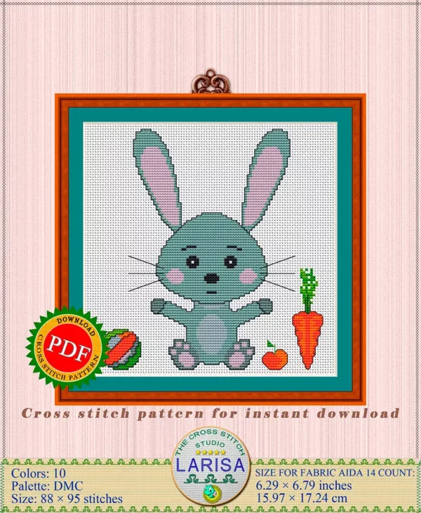Embroidered rabbit holds carrot and apple in paws
